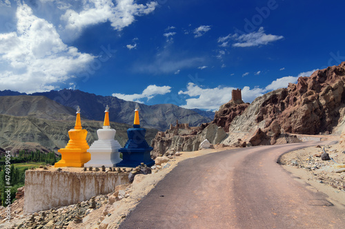 Three colourful buddhist religious stupas at Leh, Ladakh, Jammu and Kashmir, India photo