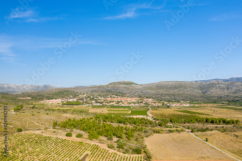 The village of Opoul Perillos in the middle of the arid countryside in Europe, France, Occitanie, the Pyrenees Orientales, in summer, on a sunny day.