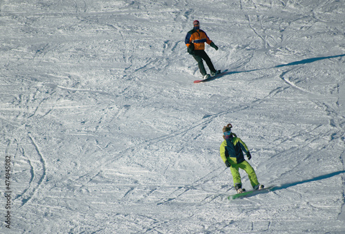 Snowboarders on the snowy slope photo