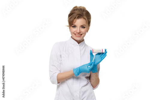 Happy woman doctor holds indicator in hands isolated on white background.