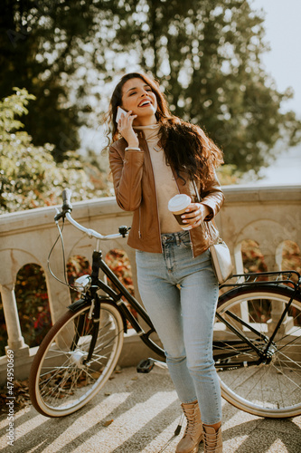 Young woman with mobile pho...