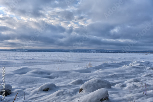 Snowy Lake Onega in winter © Evdoha
