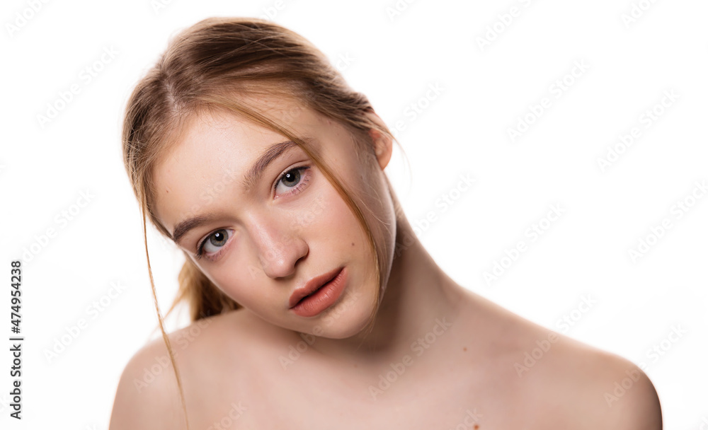 Beauty young woman face. Portrait of cute blonde female with fresh clean skin looking at camera. Isolated on white background. Beautiful, spa and skin care concept. Beauty young woman face. Portrait of cute blonde female with fresh clean skin looking at camera. Isolated on white background. Beautiful, spa and skin care concept.