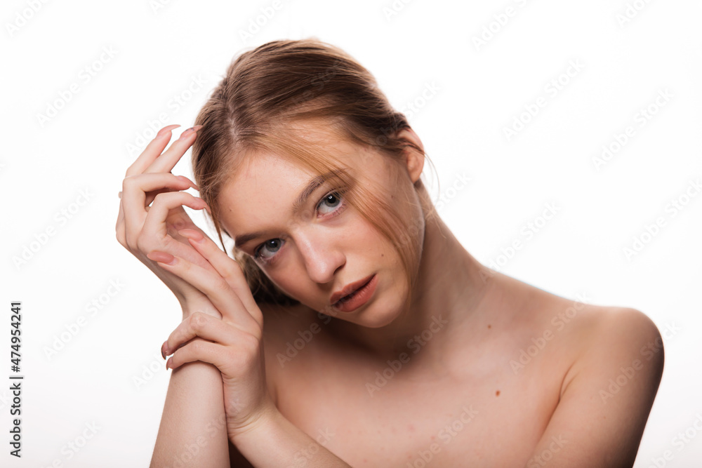 Beauty young woman face. Portrait of cute blonde female with fresh clean skin looking at camera. Isolated on white background. Beautiful, spa and skin care concept. Beauty young woman face. Portrait of cute blonde female with fresh clean skin looking at camera. Isolated on white background. Beautiful, spa and skin care concept.