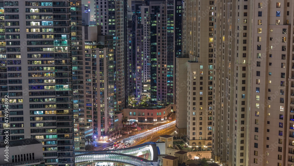 Overview to JBR and Dubai Marina skyline with modern high rise skyscrapers waterfront living apartments aerial night timelapse Overview to JBR and Dubai Marina skyline with modern high rise skyscrapers waterfront living apartments aerial night timelapse