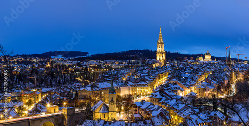 Panorama of the town center of Bern in winter blue hour with snowy and illuminated buildings, Rosengarten, Bern, UNESCO, Switzerland