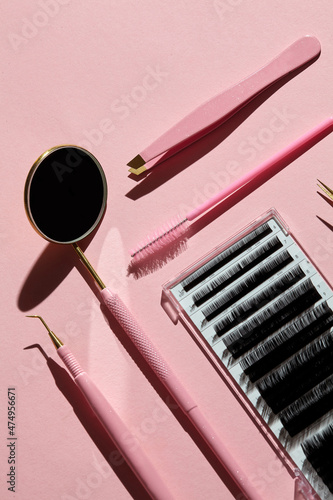 Pink Tools for Eyelash Extension Procedure.On pink background.Beauty and fashion concept.Mockup