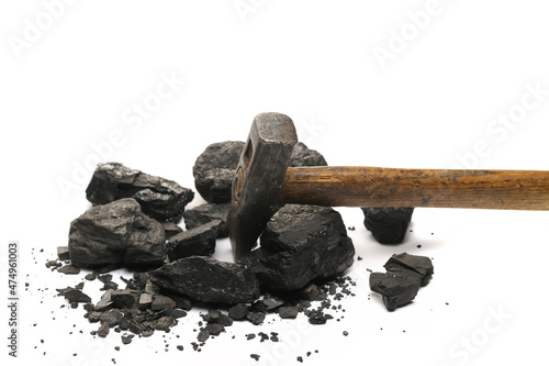 Fototapeta Black coal chunks with hammer isolated on white background