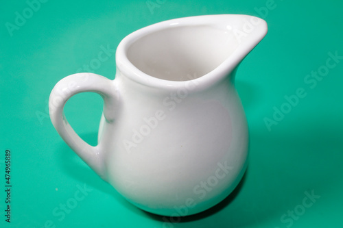 White ceramic milk jug with vintage design