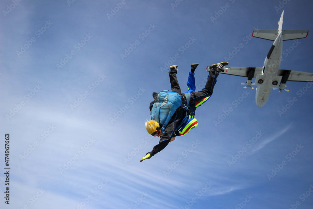 Skydiving. Tandem jump. A man and his instructor are flying across the sky. Skydiving. Tandem jump. A man and his instructor are flying across the sky.