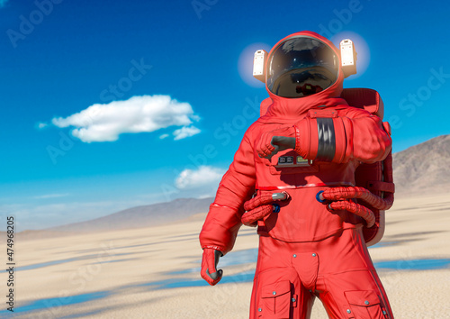 astronaut is checking the air in the desert of another planet after rain with copy space © DM7