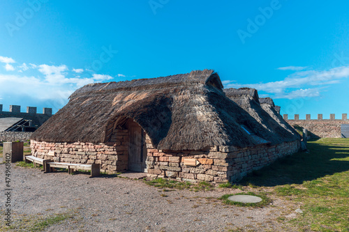 Thatched huts in Eketorps borg, a viking village in Öland, Sweden