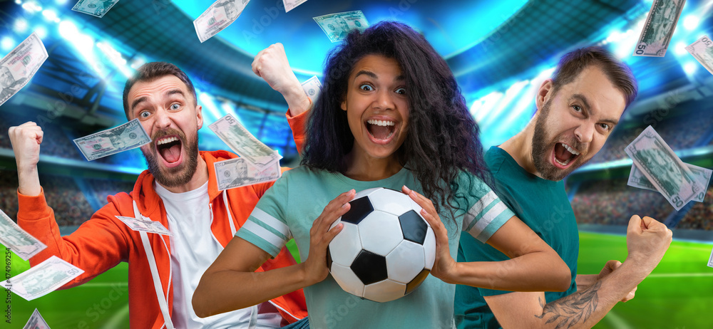 Group of happy soccer fans celebrating money win after betting at favourite team at bookmaker's website, with the stadium and flying dollar banknotes on the background