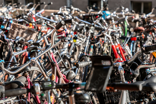 Lots of bikes parked at a r...