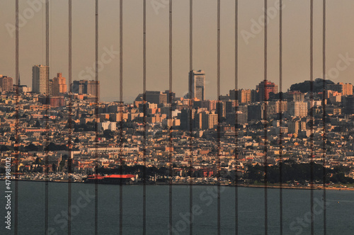 Canvas Print A view of San Francisco skyline through the cables of the Golden Gate Bridge, Ca