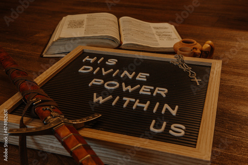 Fotografija Letterboard with bible, sword, cross necklace and brown themed