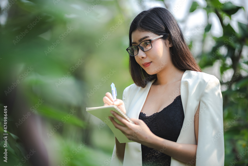young Asian business woman working outdoor with online cyberspace communication, happy lifestyle young Asian business woman working outdoor with online cyberspace communication, happy lifestyle
