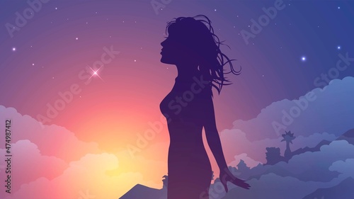 Silhouette of a woman at sunset on a tropical beach