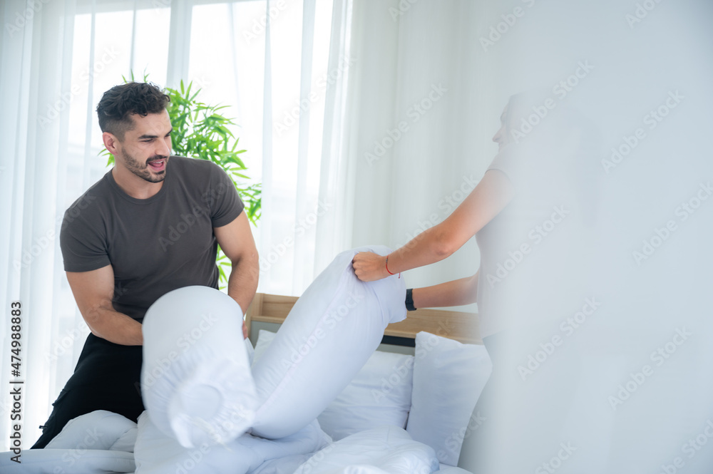 couple person wife and husband are happy love together and fun to playing in bed room at home couple person wife and husband are happy love together and fun to playing in bed room at home