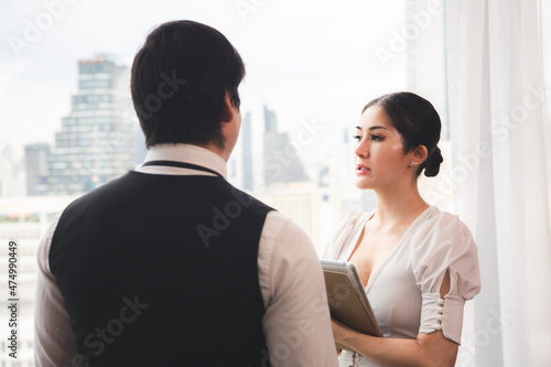 business partner with man and woman talking together in modern office, work meeting