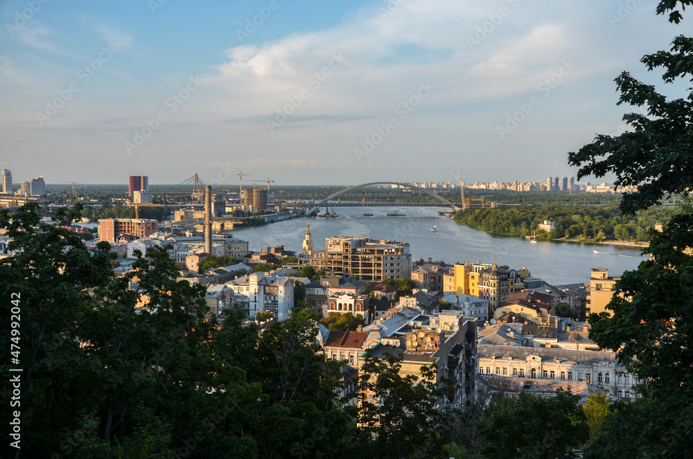 Panoramic view of Dnipro river and the historic district Podil during sunset. Kyiv, Ukraine
