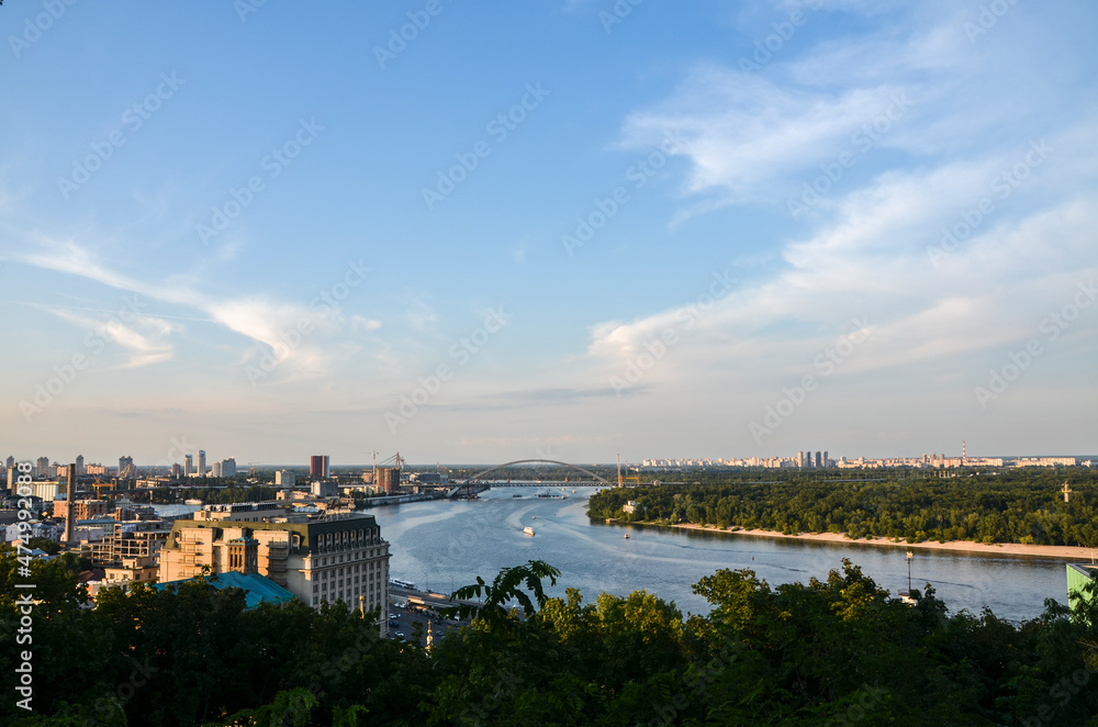 Panoramic view of Dnipro river and the historic district Podil during sunset. Kyiv, Ukraine