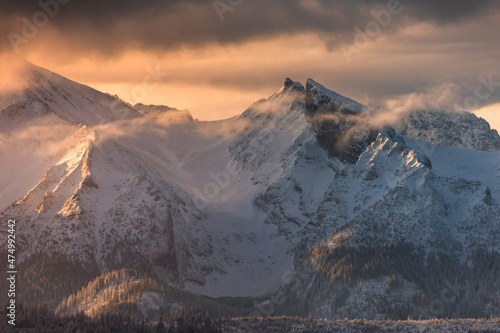 Fototapeta Naklejka Na Ścianę i Meble -  A beautiful winter morning with a view of the High Tatras. The snow created an amazing atmosphere in the photo.