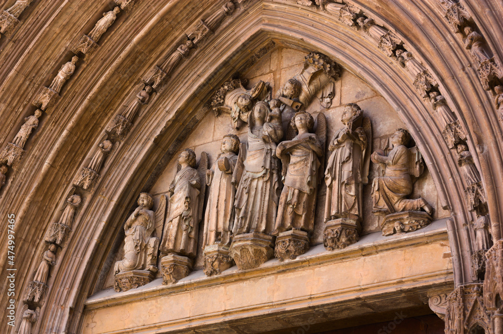 Tympanum with the statue of Saint Mary on the door of the Apostles of the Cathedral of Santa Maria in Valencia, Spain