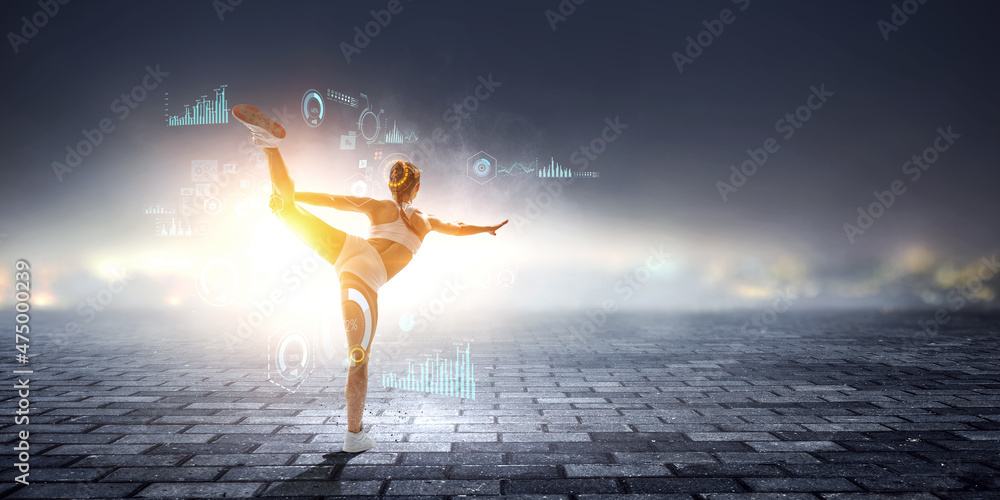 Young beautiful girl wearing fashion sports wear doing exercise . Mixed media Young beautiful girl wearing fashion sports wear doing exercise . Mixed media