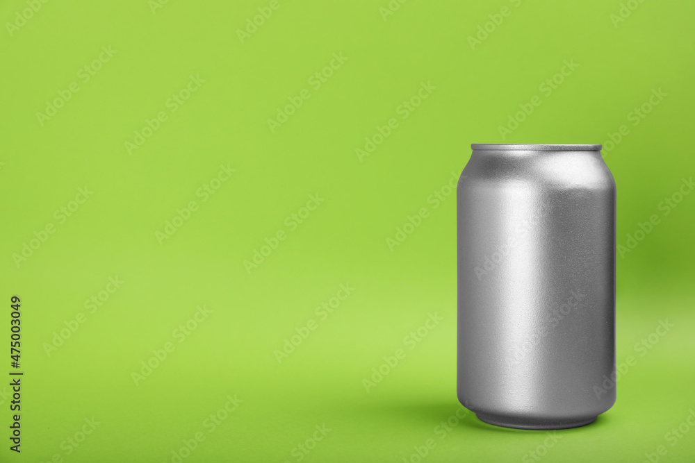 Can of energy drink on green background. Space for text Can of energy drink on green background. Space for text