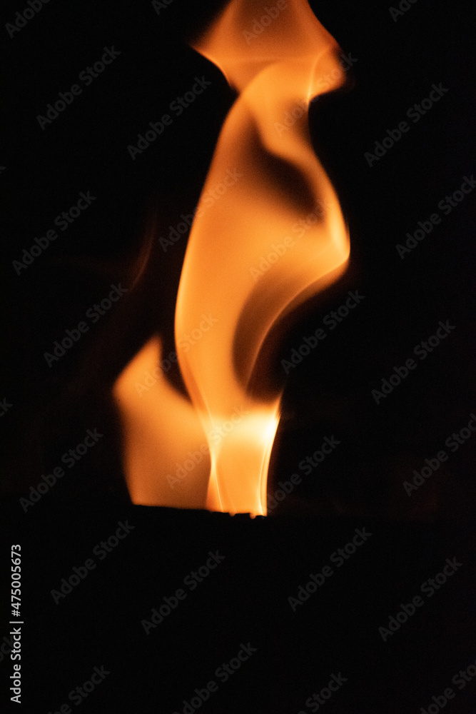 Fire flames on black background. lights on a black background. Fire flames on black background. lights on a black background.