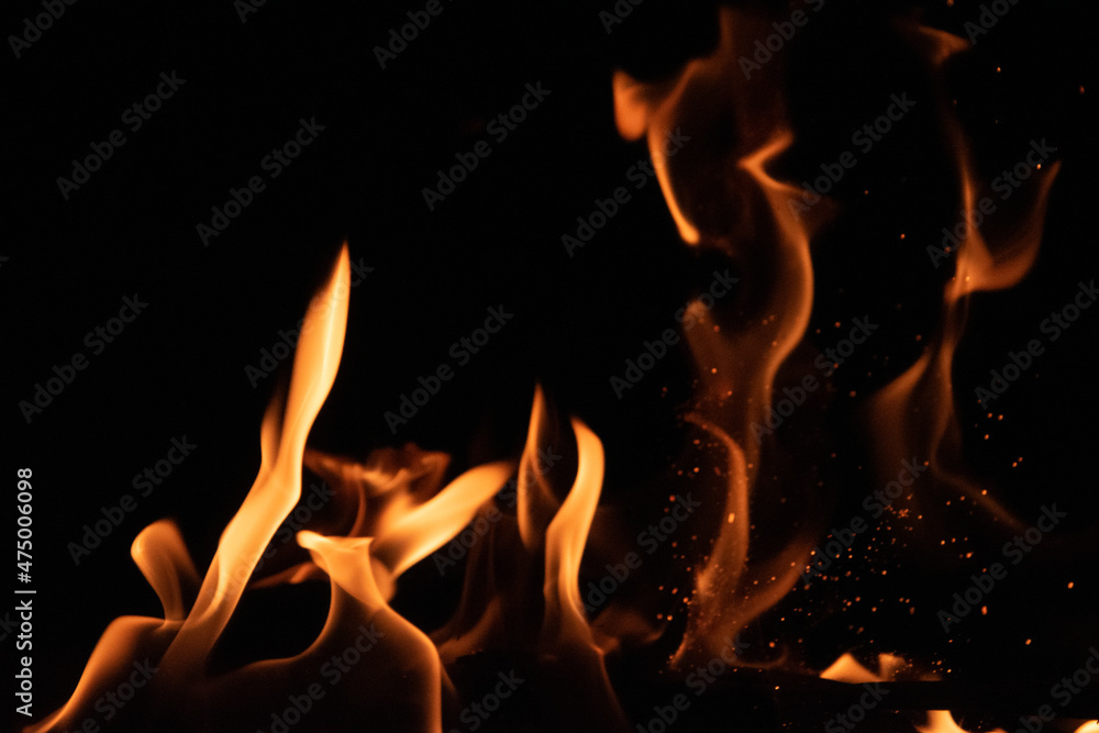 Fototapeta premium Fire flames on black background. lights on a black background.