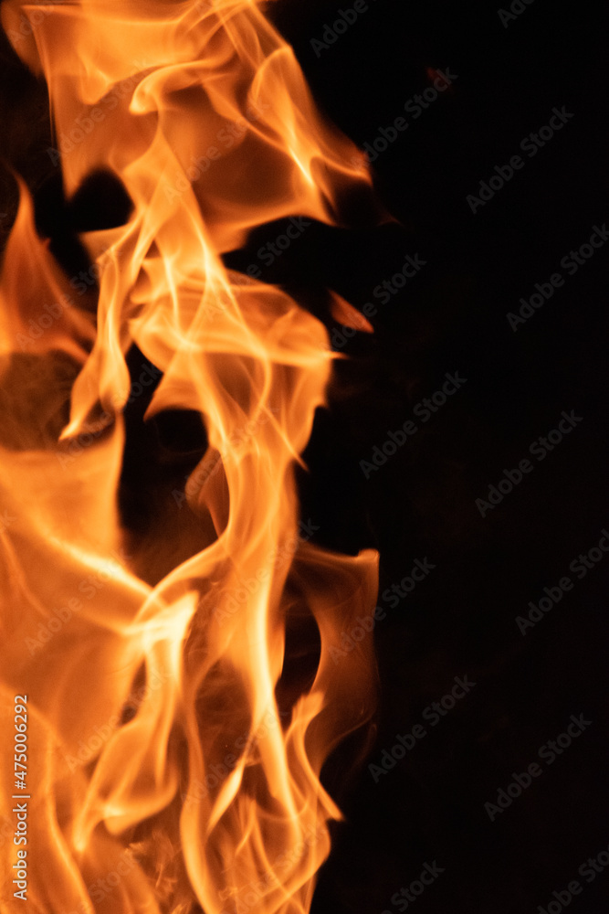 Fire flames on black background. lights on a black background. Fire flames on black background. lights on a black background.