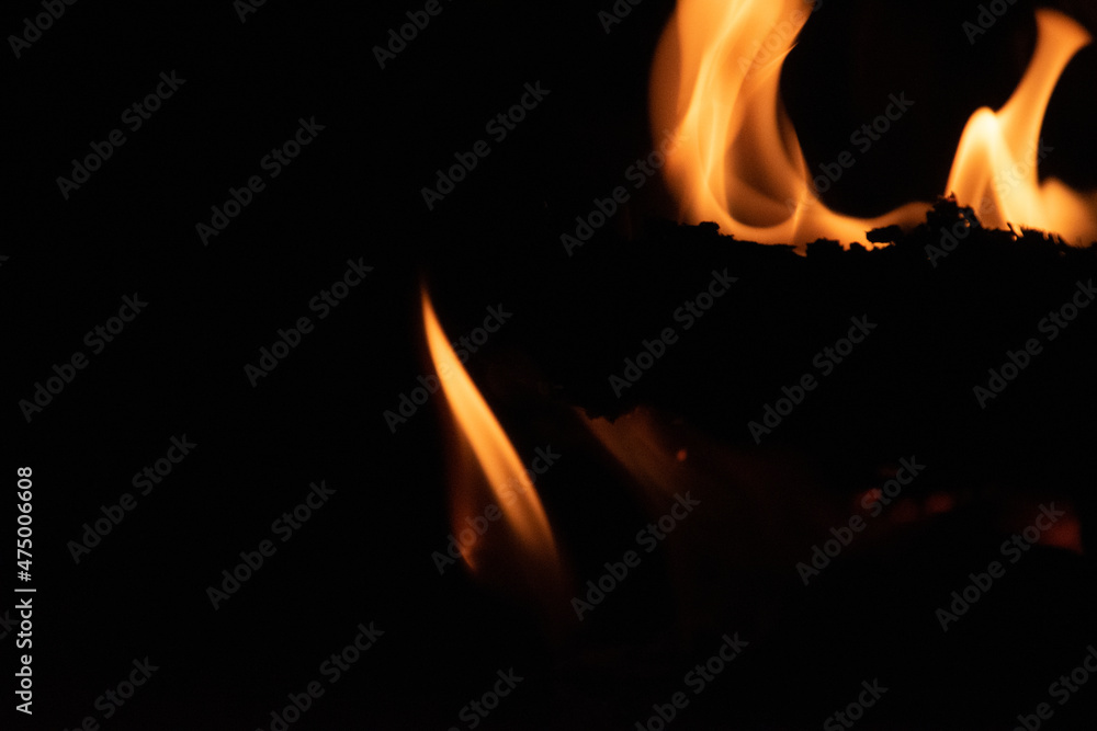 Fire flames on black background. lights on a black background. Fire flames on black background. lights on a black background.