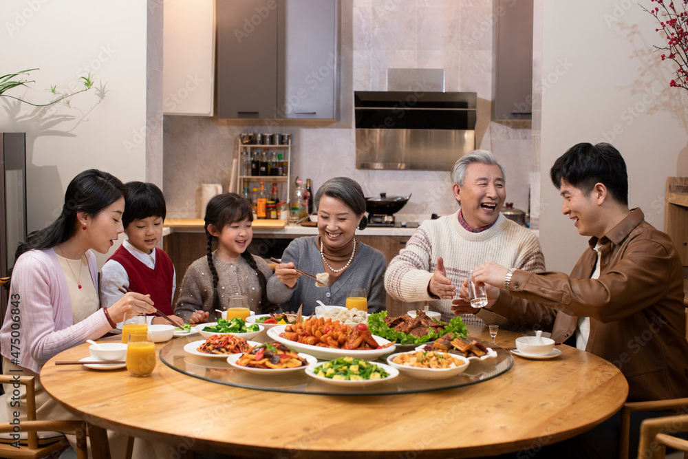 Happy family having Chinese New Year dinner