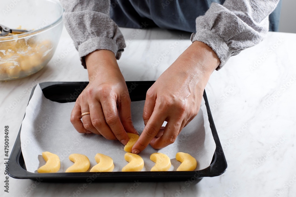 Arrange Putri Salju (Vanillekipferl) on Baking Tray, Step by Step before Baked Cookies. Arrange Putri Salju (Vanillekipferl) on Baking Tray, Step by Step before Baked Cookies.