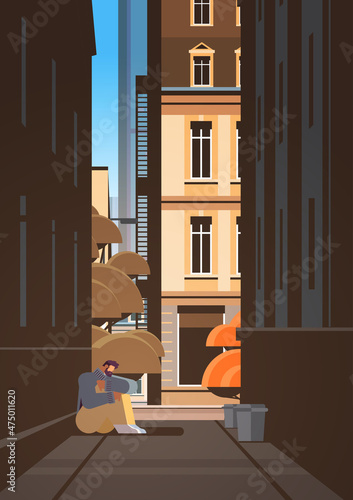 sad unhappy man depressed guy sitting on street near building loneliness depressive disorder problem mental health diseases