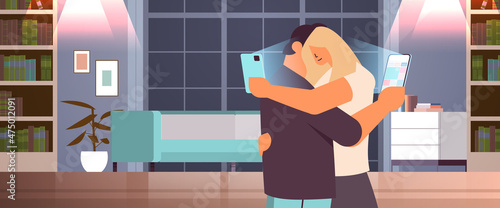 addicted couple hugging and using digital gadgets man woman active in social networks digital addiction concept