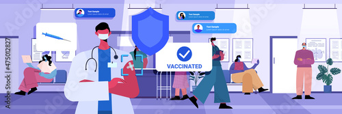 vaccinated people men women after vaccine injection successful covid-19 vaccination concept hospital corridor interior