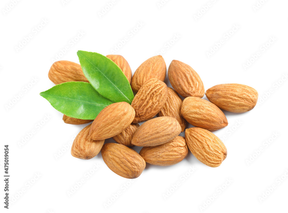 Organic almond nuts and green leaves on white background. Healthy snack Organic almond nuts and green leaves on white background. Healthy snack