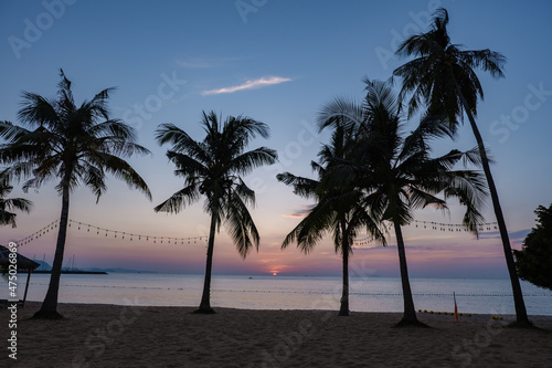 Najomtien beach Pattaya Thailand, sunset at a tropical beach with palm trees. Pattaya Thailand photo