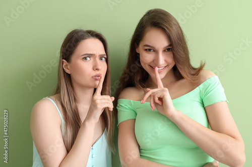 Young women showing silence...