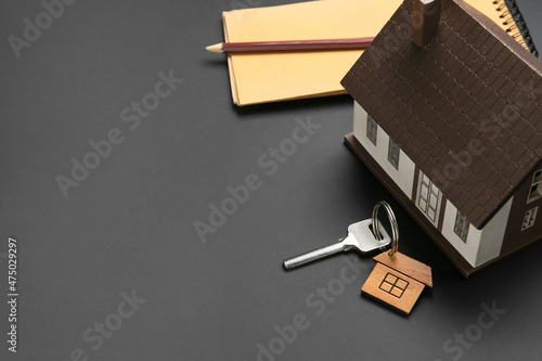 House model with key on dar...