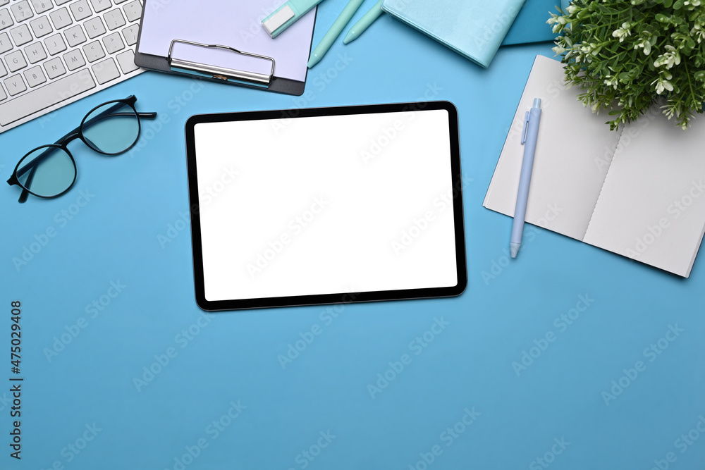 Top view Digital tablet with empty display, glasses and notebooks on lea background. Top view Digital tablet with empty display, glasses and notebooks on lea background.