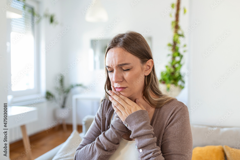 Tooth Pain And Dentistry. Young Woman Suffering From Terrible Strong Teeth Pain, Touching Cheek With Hand. Female Feeling Painful Toothache. Dental Care And Health Concept. Tooth Pain And Dentistry. Young Woman Suffering From Terrible Strong Teeth Pain, Touching Cheek With Hand. Female Feeling Painful Toothache. Dental Care And Health Concept.