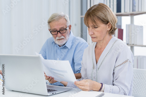 Stressed husband, wife senior couple elderly family, caucasian mature, retired calculate budget from invoice, expense or bill, no money to pay. Mortgage, loan causing debt, bankruptcy of financial.