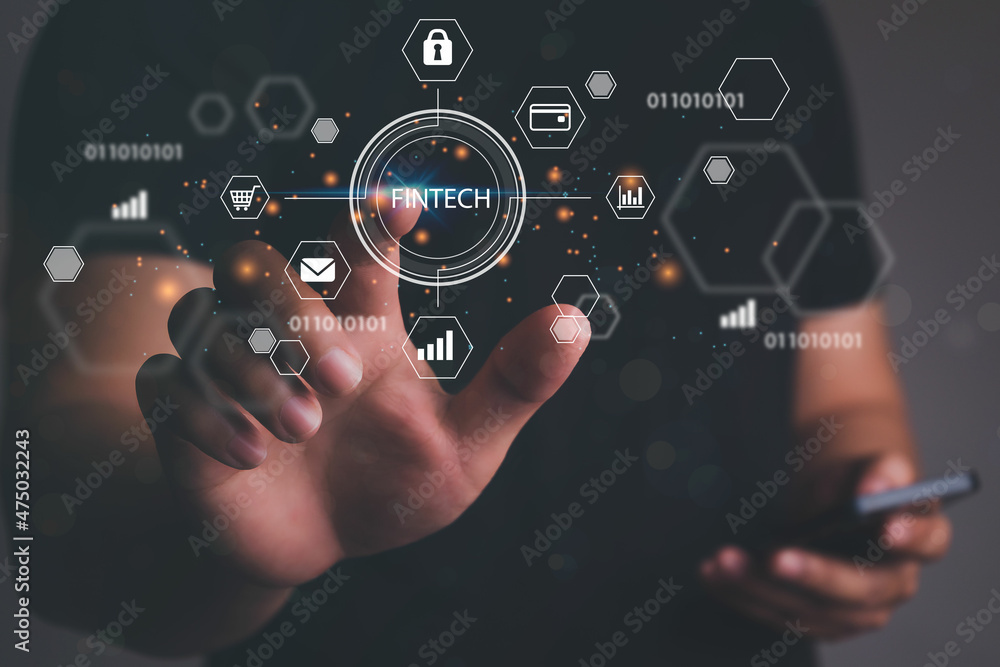 Man hand touching virtual screen to Fintech Financial technology Cryptocurrency investment and digital money. Business concept on virtual screen. Man hand touching virtual screen to Fintech Financial technology Cryptocurrency investment and digital money. Business concept on virtual screen.