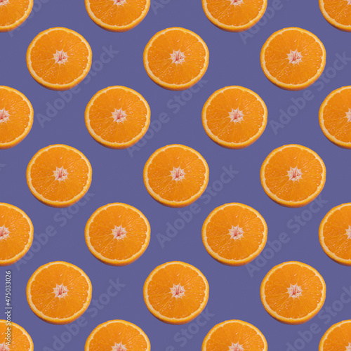 Seamless pattern of half of an orange isolated on Color of the year 2022 Very Peri. Trending color 2022. Minimal, food texture