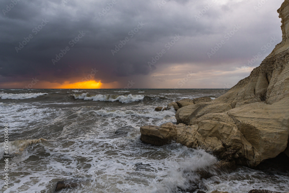 Stormy weather in the evening at sunset on the Mediterranean coast near Rosh HaNikra in Israel Stormy weather in the evening at sunset on the Mediterranean coast near Rosh HaNikra in Israel