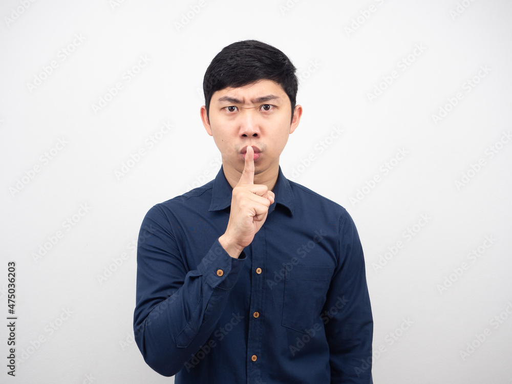 Asian man gesture shush serious face slient concept white background Asian man gesture shush serious face slient concept white background